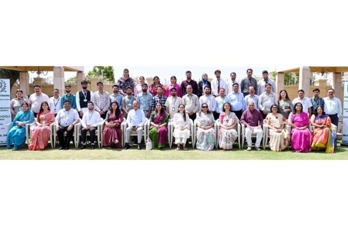 Dignitaries posing along with school management during a programme. Dignitaries posing along with school management during a programme.