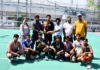 Winning team posing along with dignitaries during prize distribution ceremony.