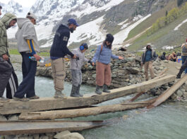 A view of a dilapidated wooden bridge at Thajwas glacier site in Sonamarg. —Excelsior/Firdous Ahmad