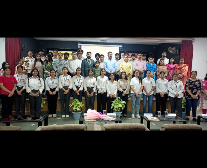 Dignitaries posing along with students during a programme. Dignitaries posing along with students during a programme.