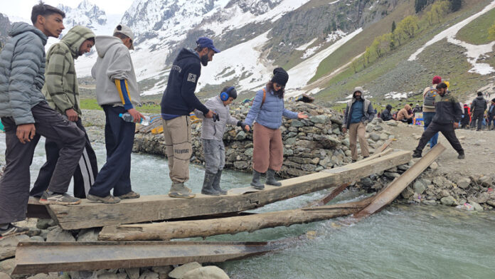 A view of a dilapidated wooden bridge at Thajwas glacier site in Sonamarg. —Excelsior/Firdous Ahmad