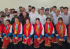 International medal-winning girls with dignitaries during a ceremony in Udhampur.