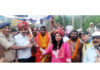 MLA Udhampur West Pawan Kumar Gupta and others posing along with wrestler.
