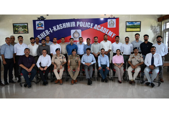 DIG Shiv Kumar Sharma posing with trainee officers at SKPA Udhampur on Saturday.