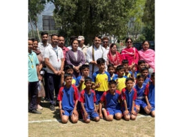 MLA Udhampur East, Ranbir Singh Pathania posing along with young players during an inaugural event at Tikri.
