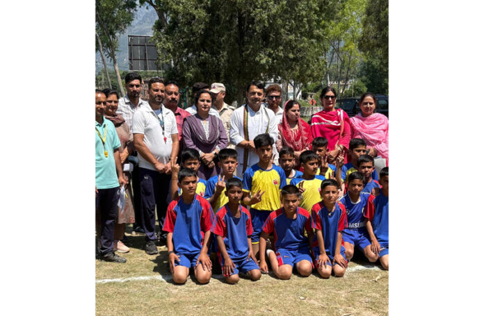 MLA Udhampur East, Ranbir Singh Pathania posing along with young players during an inaugural event at Tikri.