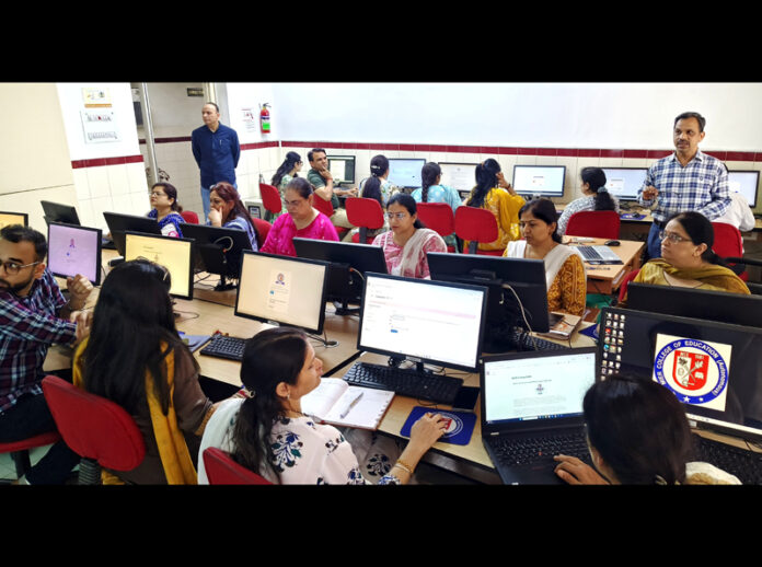 Faculty members during Moodle-based course development workshop at MIER College of Education.