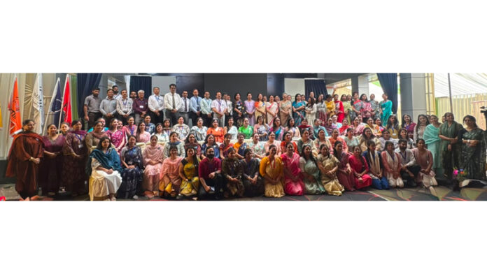 Participants posing along with dignitaries during a programme.