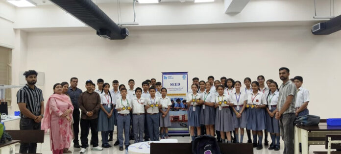 Students posing along with dignitaries during SEED Programme at IIT Jammu.