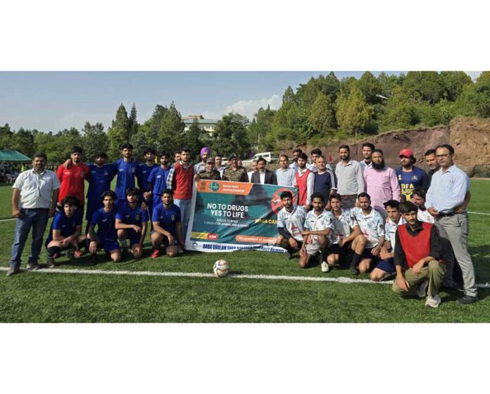 Football teams posing with dignitaries during the final match of Rajouri Football League at BGSBU, Rajouri. — Excelsior/Imran Football teams posing with dignitaries during the final match of Rajouri Football League at BGSBU, Rajouri. — Excelsior/Imran