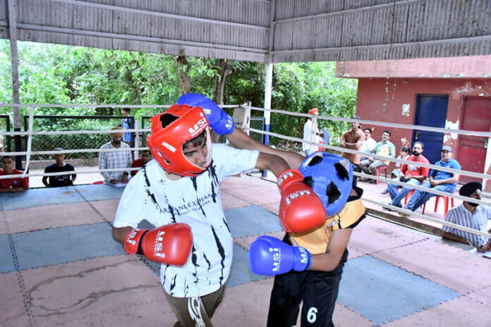 Athletes in action during a match in Jammu on Monday. Athletes in action during a match in Jammu on Monday.