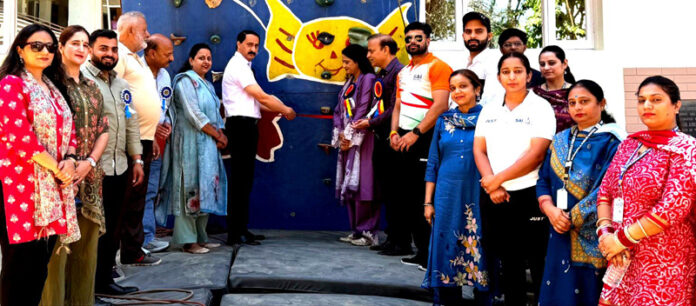 Dignitary inaugurating sports climbing completion.