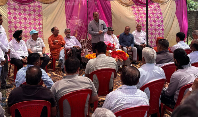 MLA Ramgarh, Dr. Devinder Kumar Manyal addressing a gathering after starting work on vital roads in his constituency.