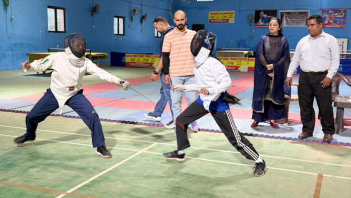 Fencers in action during a match in Udhampur.