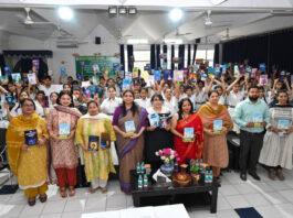 Dignitary along with school management posing during a programme.