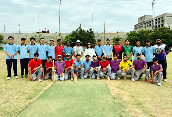 Players posing along with dignitaries during an event.
