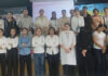 Students posing along with dignitaries during a programme.