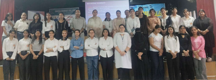 Students posing along with dignitaries during a programme.