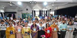 Dignitary along with school management posing during a programme.
