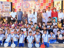 Students posing along with dignitaries during a programme.