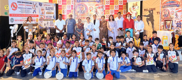 Students posing along with dignitaries during a programme.