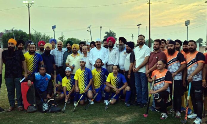 Hockey players posing with dignitaries during inauguration ceremony at Gole Gujral, Jammu.