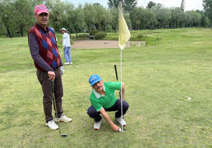 Golfer Muzaffar Ahmad Jan at Kashmir Golf Club Srinagar displaying “Hole in One” feat.