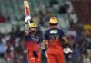 Virat Kohli raising his bat after scoring an unbeaten 105 runs against KKR in Raipur.