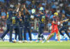 Gujarat Titans bowler celebrating with teammates after taking wicket of Virat Kohli in Ahmedabad.