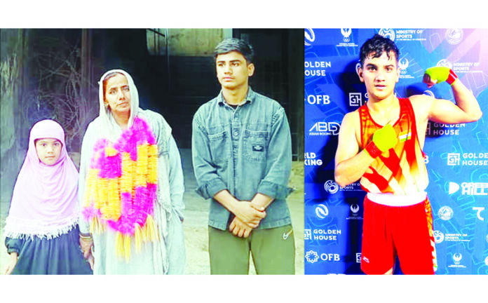 Mohd Yasser's mother and siblings outside their Rajouri home, while Yasser (R) posing for a photograph during the championship in Uzbekistan. —Excelsior/Imran Mohd Yasser's mother and siblings outside their Rajouri home, while Yasser (R) posing for a photograph during the championship in Uzbekistan. —Excelsior/Imran