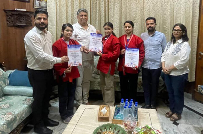 President J&K Olympic Association, Dushyant Sharma felicitating the medal winners.