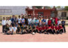 Players posing along with dignitaries during a programme.
