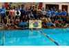 Swimmers posing along with dignitaries during selection trials.