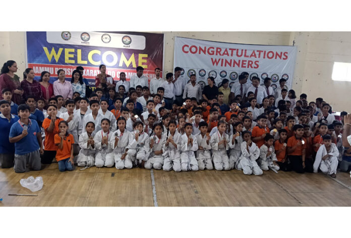 Karate players posing along with dignitaries during an event. Karate players posing along with dignitaries during an event.