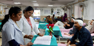 Nurses attend to patients in a hospital ward on the occasion of International Nurses Day, in Jammu on Tuesday. (UNI)