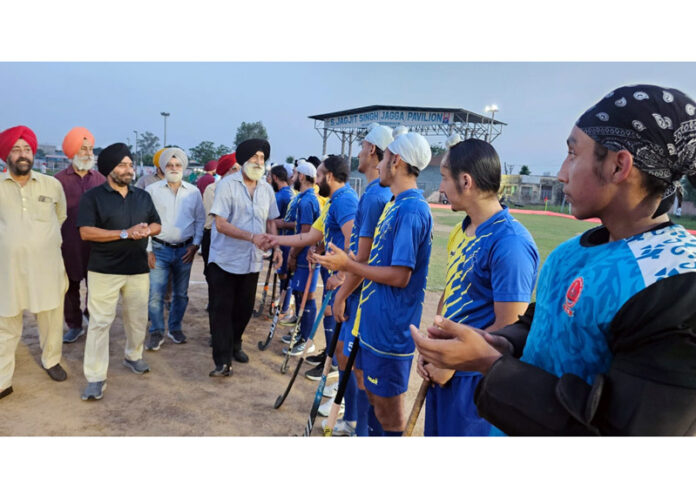 Dignitary interacting with players before start of the match.