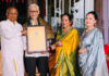 Pushkar Nath Raina being conferred with prestigious award by dignitaries at a function at Chennai .