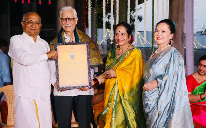 Pushkar Nath Raina being conferred with prestigious award by dignitaries at a function at Chennai .