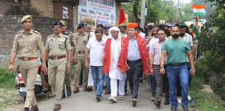 Mahant Baba Yashpal and Sanjeev Verma (Chief Electoral Officer, J&K) leading an awareness march at Jandiyal in Nagrota Constituency.