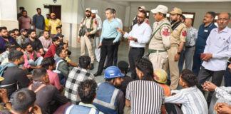 Workers of Nirman Vridhi Construction Company raising issues before Deputy Commissioner Ramban on Tuesday. —Excelsior/Parvez Mir