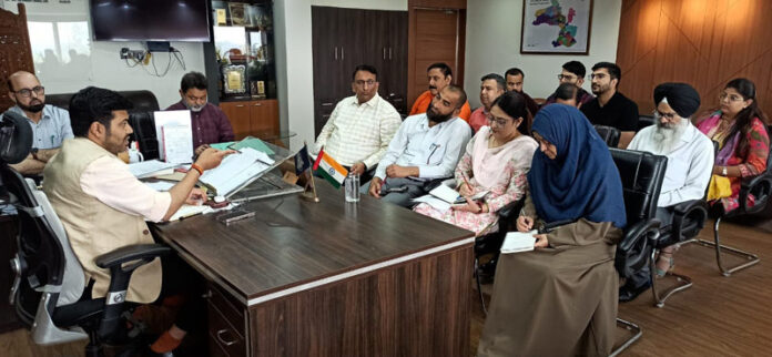 JMC Commissioner Dr Devansh Yadav chairing a meeting with senior officers of the Corporation.