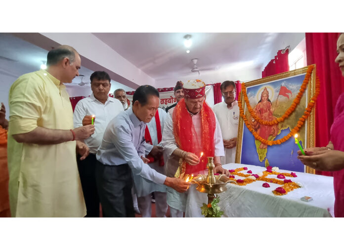Margdarshak of BTSM Indresh Kumar along with chief guest Thupten Lungring lighting ceremonial lamp at national executive meeting of the Manch in Jammu.