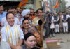 BJP celebrating party’s victory in different states at Jammu (Left). Jubiliant party activists bursting crackers at Srinagar. (Right)