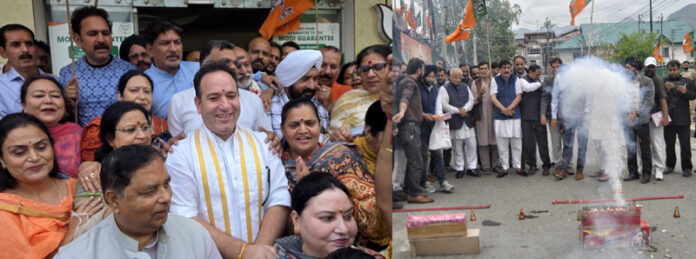 BJP celebrating party’s victory in different states at Jammu (Left). Jubiliant party activists bursting crackers at Srinagar. (Right)