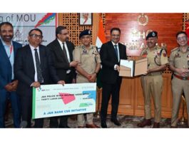 DGP J&K Nalin Prabhat and Amitava Chatterjee (MD and CEO of J&K Bank) showing signed addendum to their 2023 MoU.