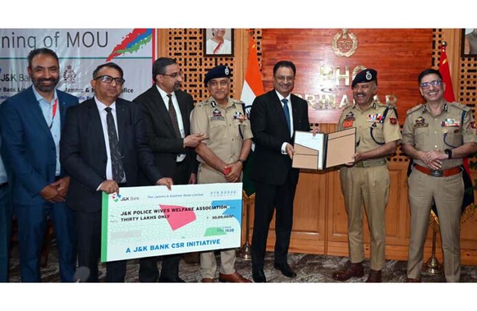 DGP J&K Nalin Prabhat and Amitava Chatterjee (MD and CEO of J&K Bank) showing signed addendum to their 2023 MoU.