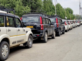 A row of parked vehicles linked to illegal roadside stands in Srinagar. -Excelsior/Shakeel