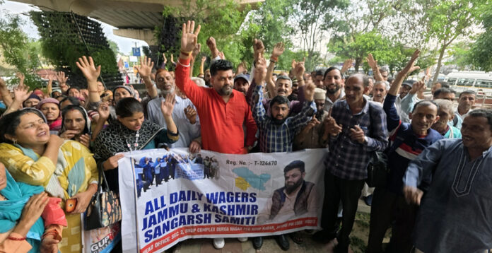 Daily wagers and consolidated workers staging protest near Press Club in Jammu on Monday. — Excelsior/ Rakesh Daily wagers and consolidated workers staging protest near Press Club in Jammu on Monday. — Excelsior/ Rakesh