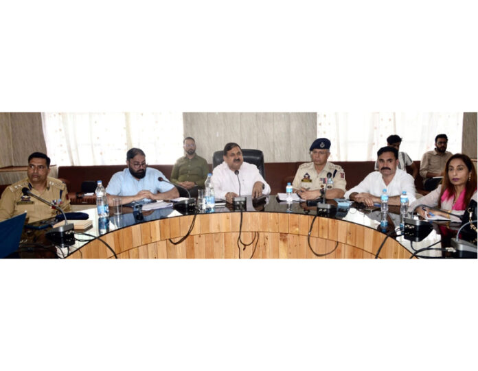 DC Poonch Ashok Kumar Sharma chairing a meeting on Friday.