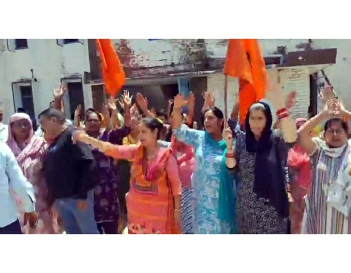Workers of Hindustan Pencils factory, Paloura, staging protest outside Deputy Labour Commissioner's office in Jammu.